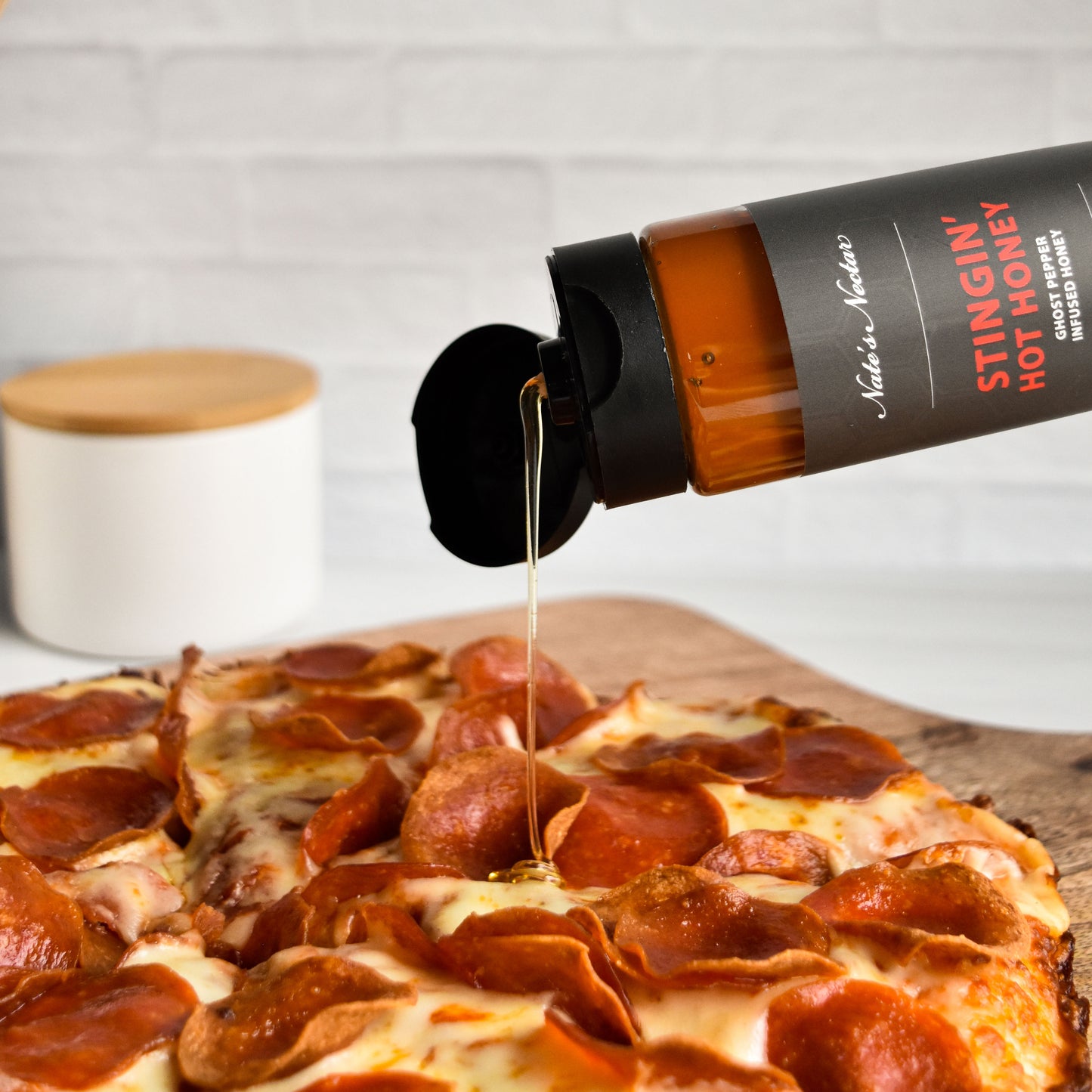 Nate's Nectar Stingin' hot honey, ghost pepper infused honey, hottest level hot honey, hot honey drizzled on pizza, hot honey pizza