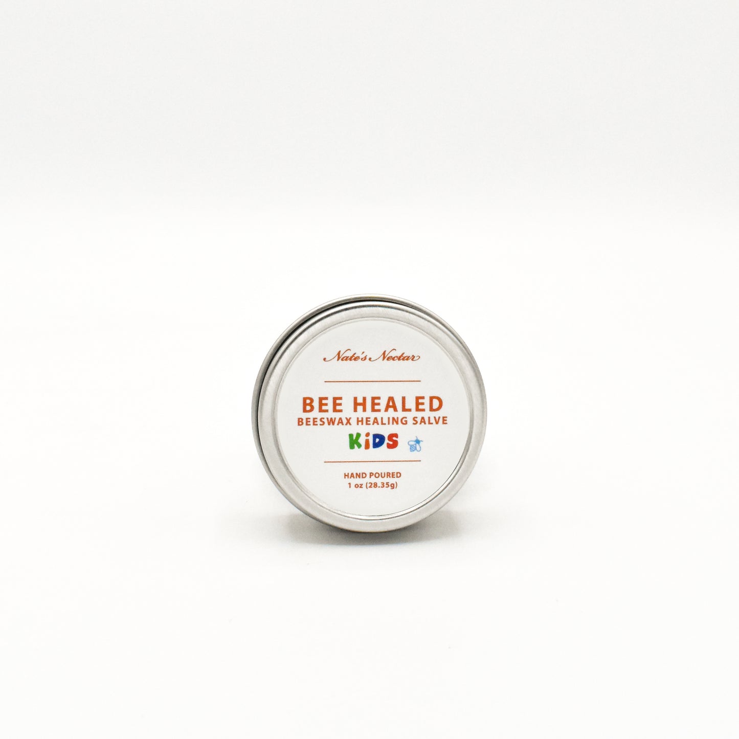 Bee Healed Kids beeswax healing salve tin on a white background