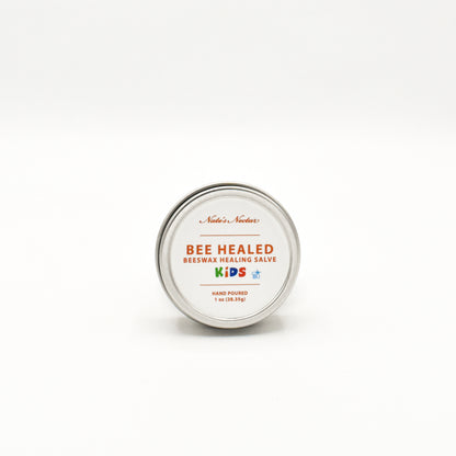 Bee Healed Kids beeswax healing salve tin on a white background