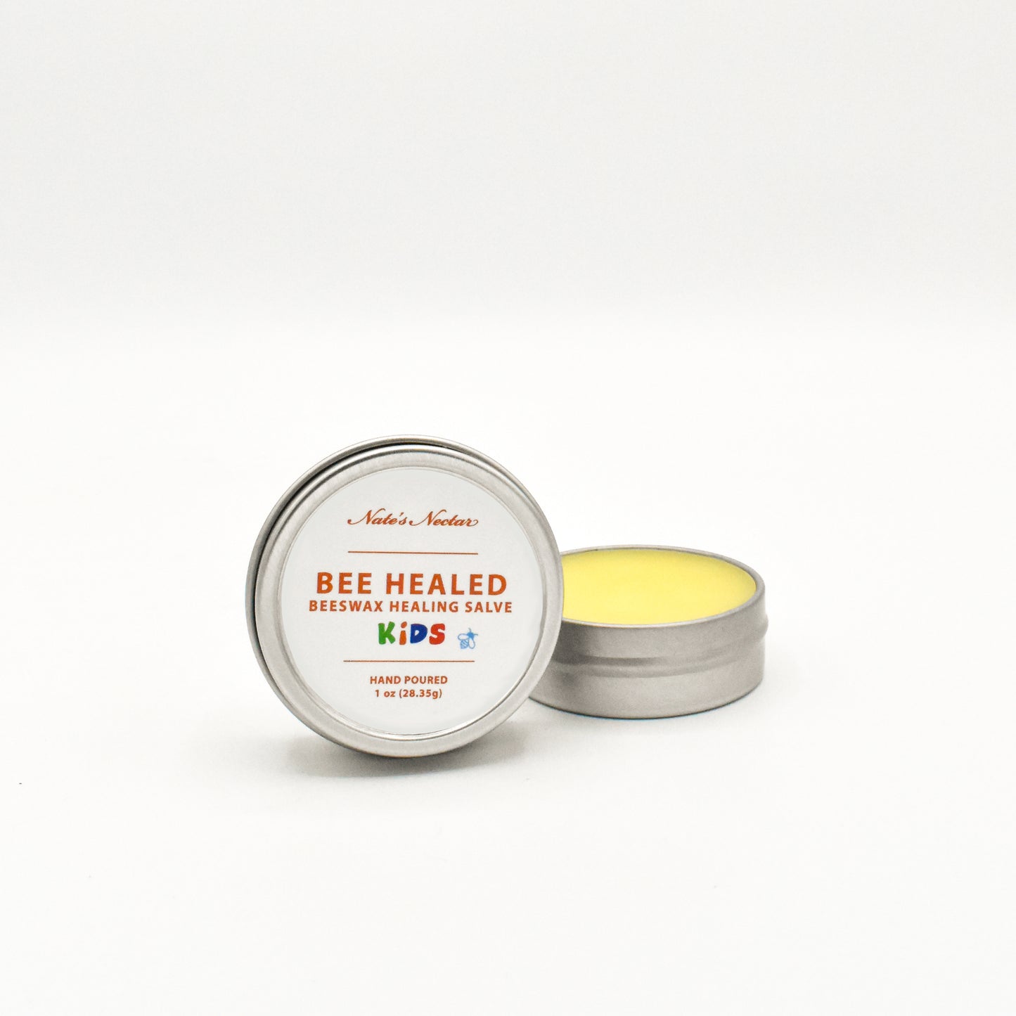 Bee Healed Beeswax Healing Salve for kids in a metal tin on a white background