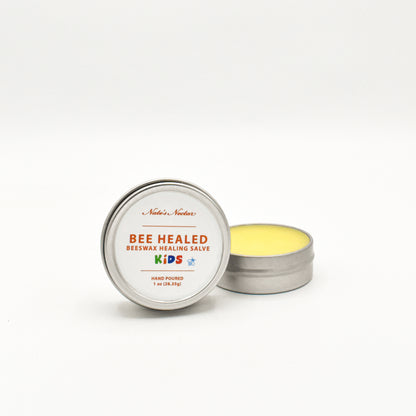 Bee Healed Beeswax Healing Salve for kids in a metal tin on a white background