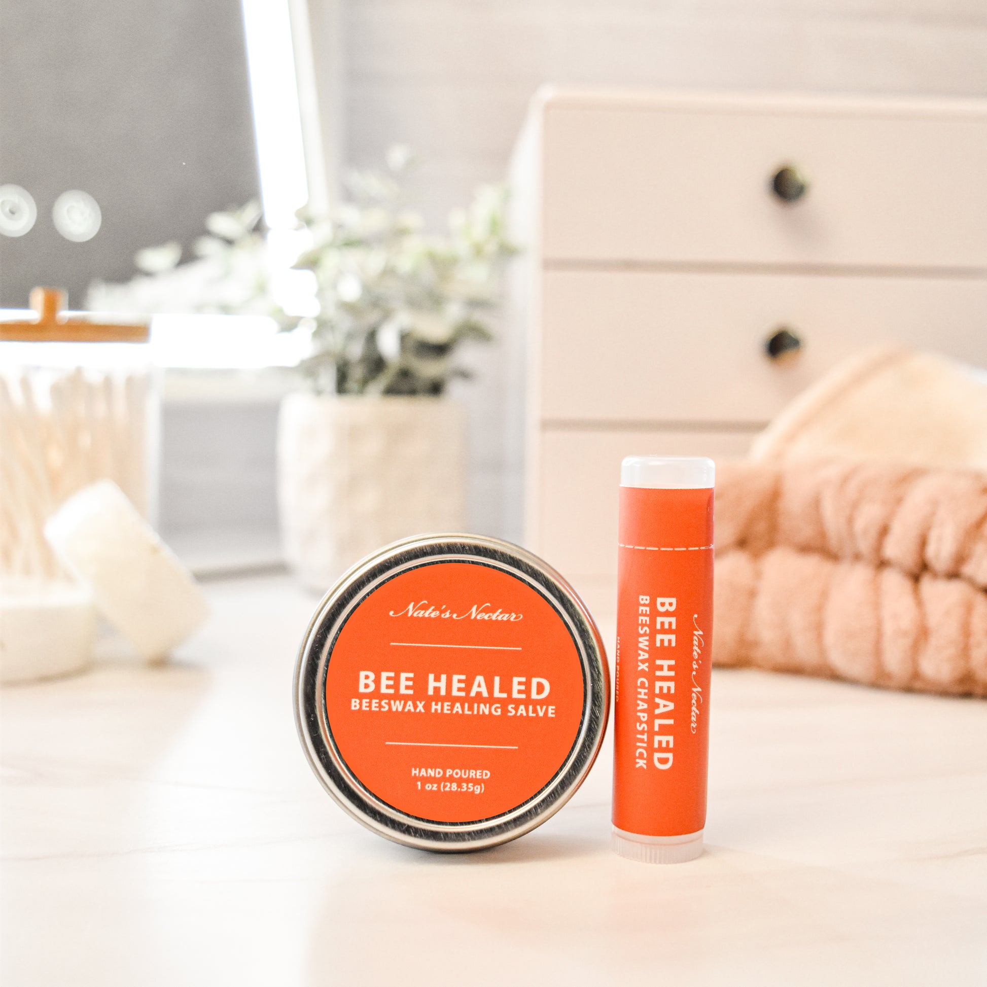 Bee Healed products on a bathroom counter with a blurred background