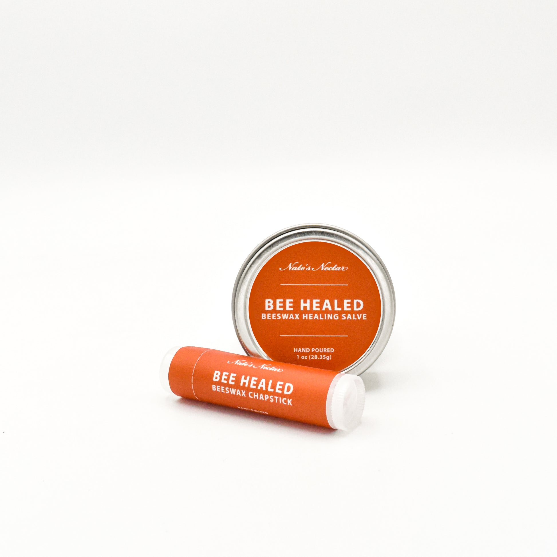 Bee Healed beeswax chapstick and salve on a white background