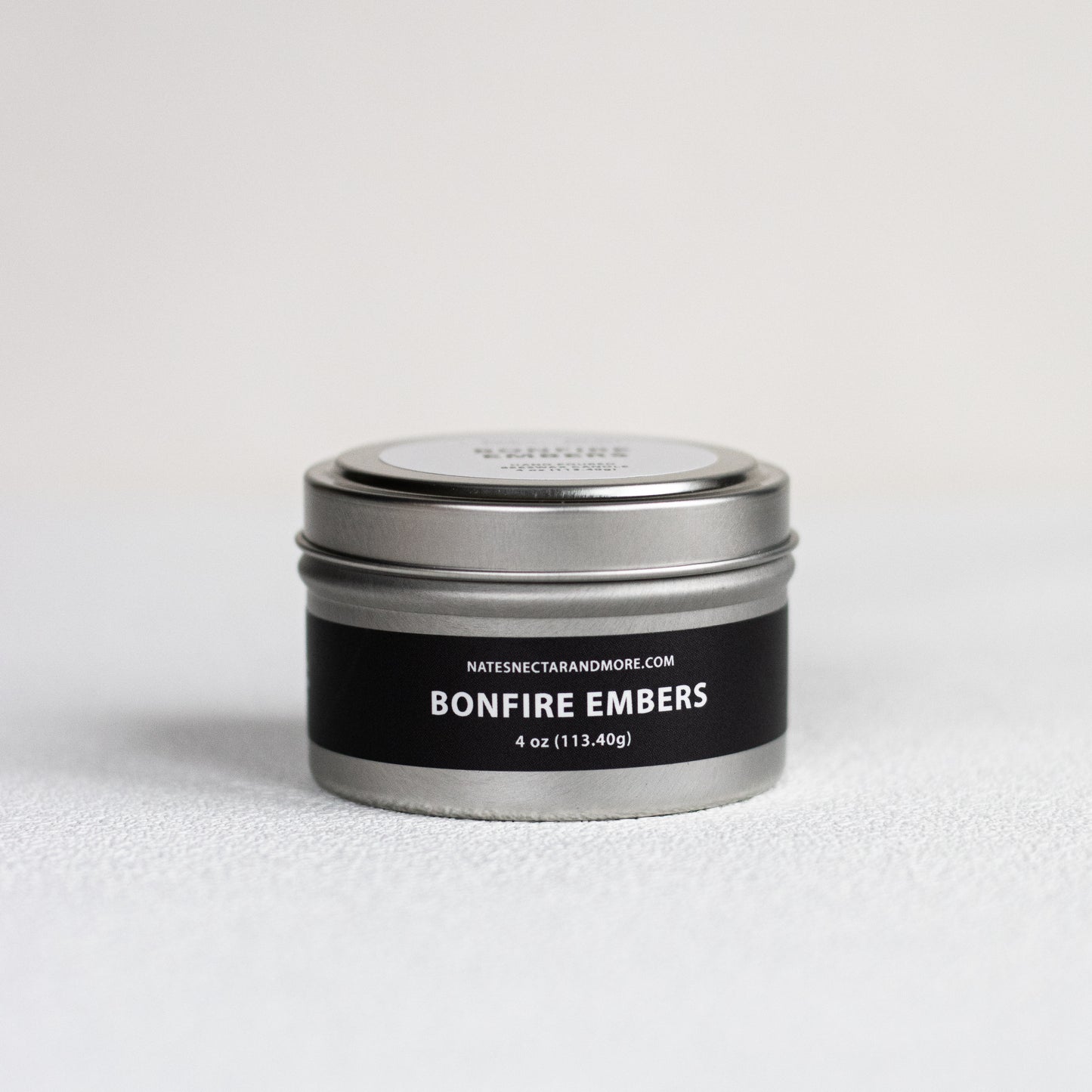 Tin labeled 'Bonfire Embers' on a light gray background