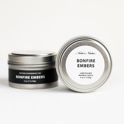 Nate's Nectar Bonfire Embers candle in a metal tin on a white background