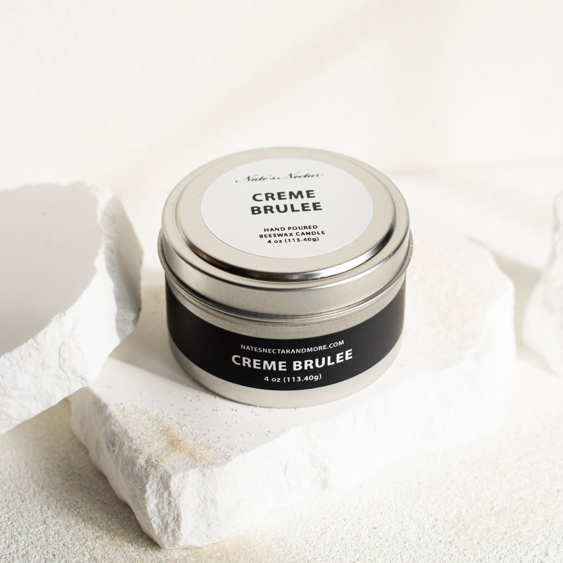 Jar of 'Creme Brèleé' on a textured white surface