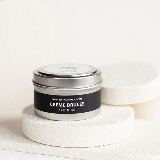 Creme Brèlee candle in a tin with a white background
