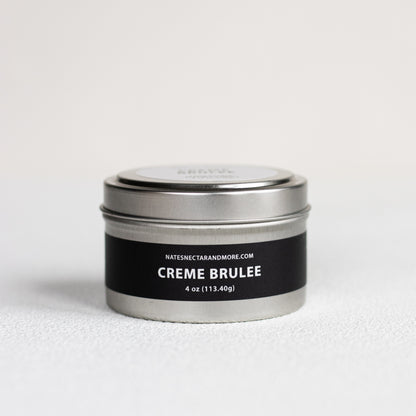 Silver tin labeled 'Creme Brulee' with a black label on a white background