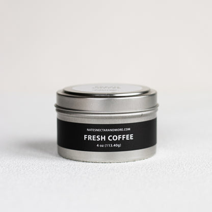 Metal tin labeled 'Fresh Coffee' on a light gray background