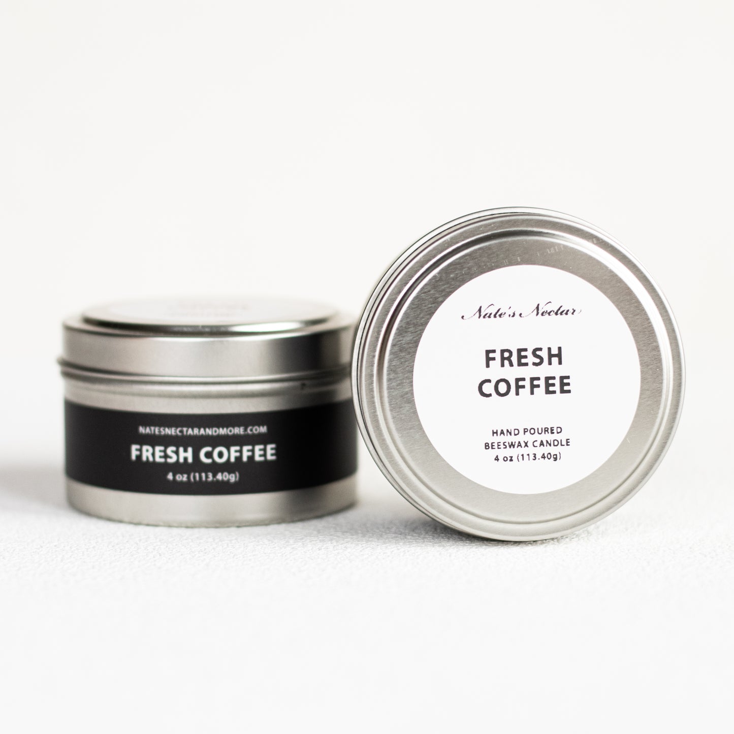 Silver candle tin labeled 'Fresh Coffee' on a white background