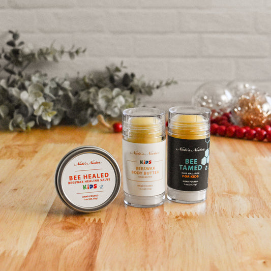 Three skincare products on a wooden surface with a decorative background