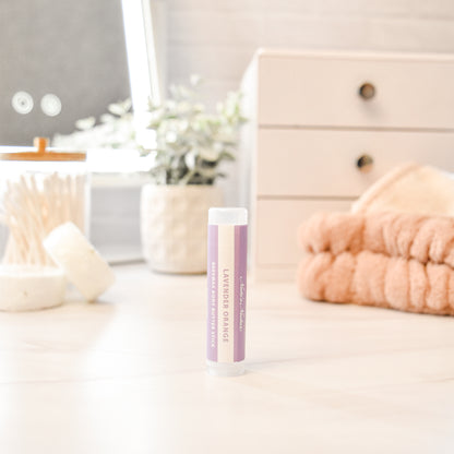 Solid lavender orange body butter in a push-up stick for on-the-go use
