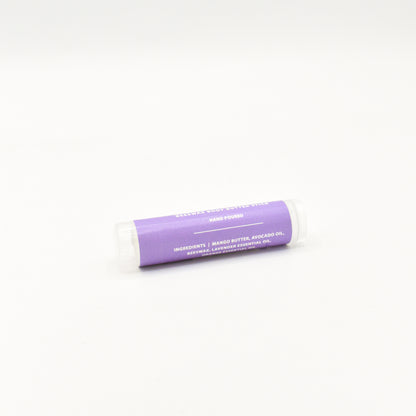 Solid lavender orange body butter in a push-up stick for on-the-go use
