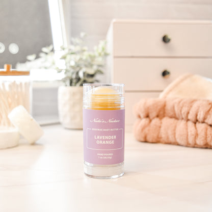 Solid lavender orange body butter in a push-up stick for on-the-go use