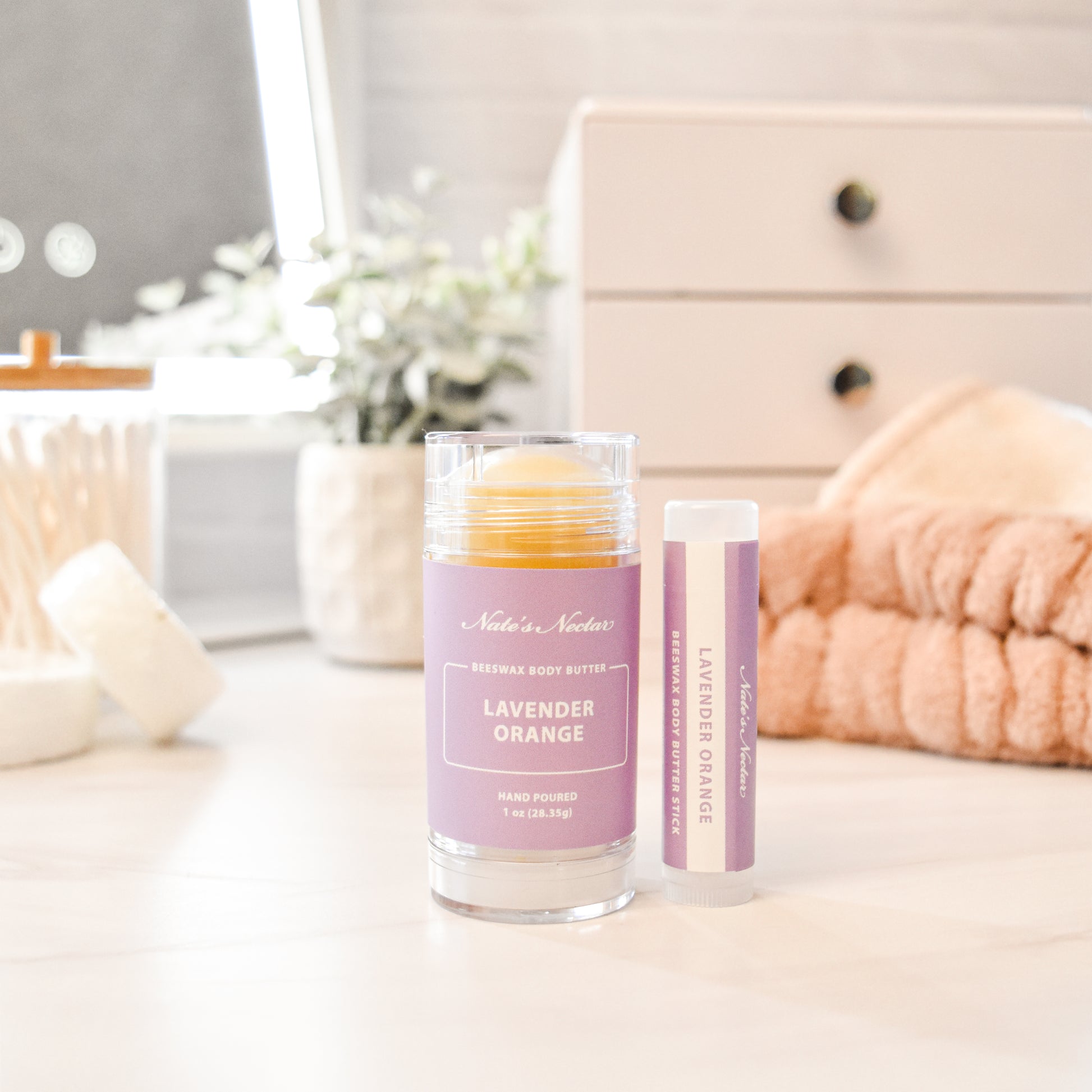 Solid lavender orange body butter in a push-up stick for on-the-go use