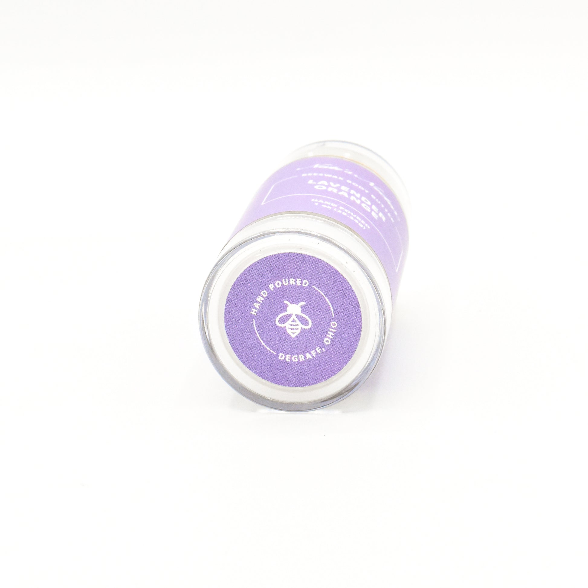 Solid lavender orange body butter in a push-up stick for on-the-go use