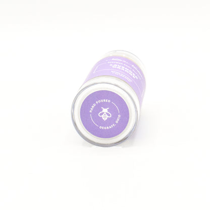 Solid lavender orange body butter in a push-up stick for on-the-go use