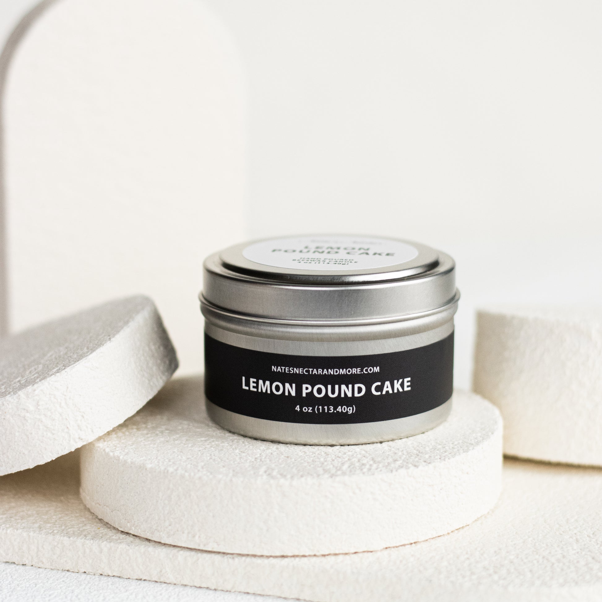 Candle jar labeled 'Lemon Pound Cake' on a white background