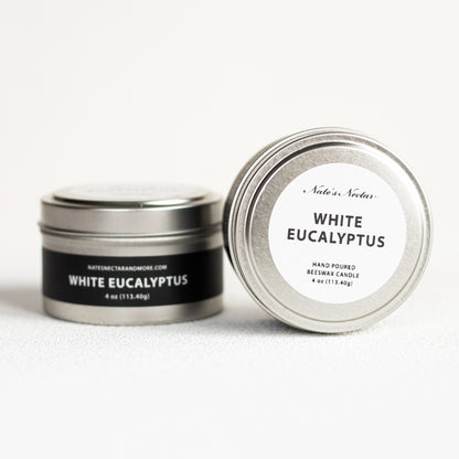Two metal tins labeled 'White Eucalyptus' on a white background